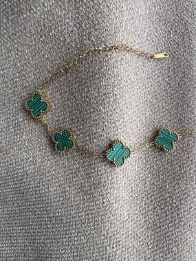 Gold Bracelet with Green Clover Motifs